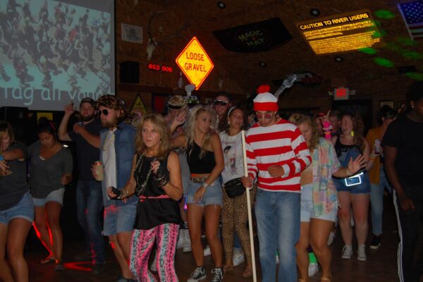 a group of people in costume in the bar