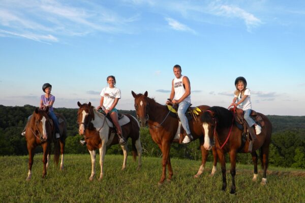 a group of kids on horses