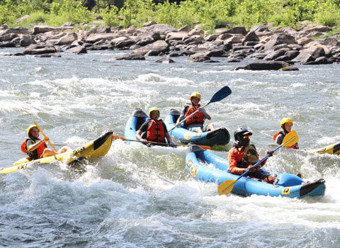 single rafters navigate the choppy waters River Expeditions West Virginia