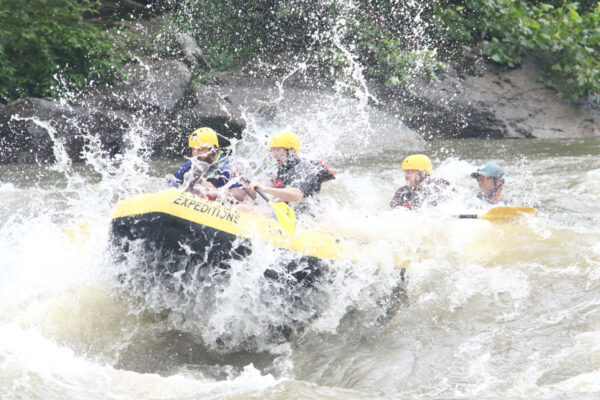 group gets a big splash while whitewater rafting River Expeditions West Virginia