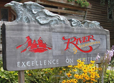 the river expeditions logo on the sign in front of the building