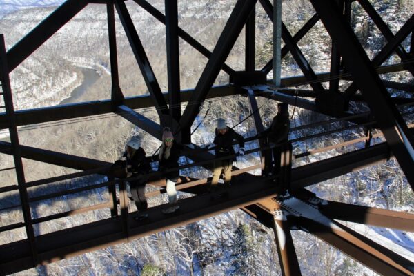 a group of people walking on the bridge