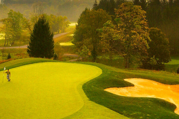 two men on putting on a golf green