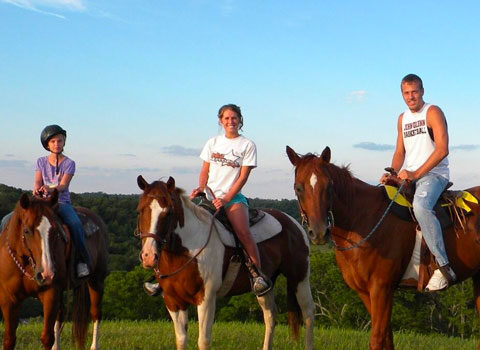a group of kids on horses