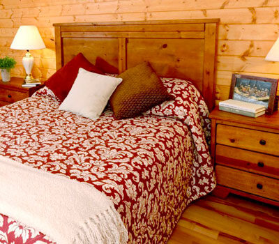 bed inside a luxury cabin at River Expeditions West Virginia