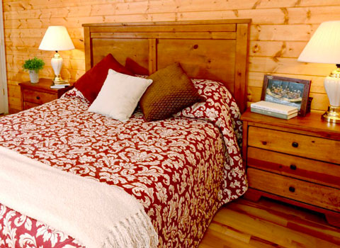 bed inside a luxury cabin at River Expeditions West Virginia