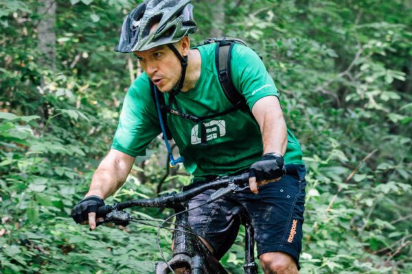 a man on a mountain bike focused on the trail