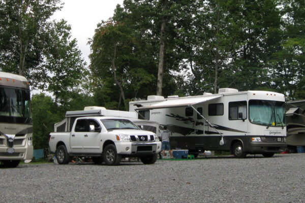 a group of RVs parked at the RV site