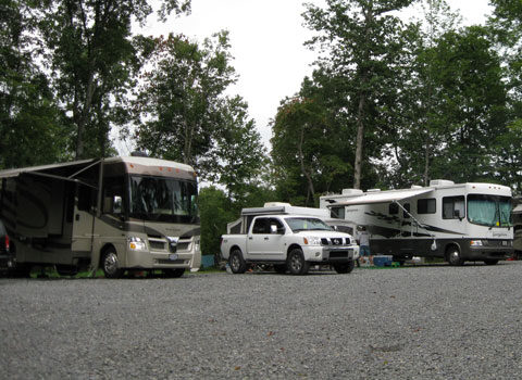 a group of RVs parked at the RV site