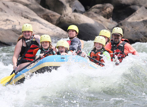 family has fun on a scenic whitewater rafting trip with River Expeditions West Virginia