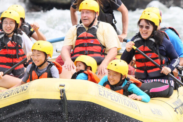 family has fun on a scenic whitewater rafting trip with River Expeditions West Virginia