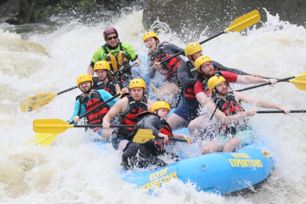 rafters use paddles to avoid rocks on the Gauley River at River Expeditions West Virginia