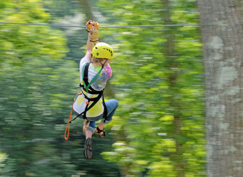 ziplining through the trees at River Expeditions West Virginia